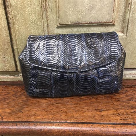 snakeskin navy handbag.